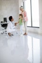 Cute little girl with her grandmother at the pediatrician examination Royalty Free Stock Photo