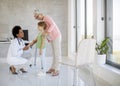 Cute little girl with her grandmother at the pediatrician examination Royalty Free Stock Photo