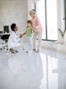 Cute little girl with her grandmother at the pediatrician examination Royalty Free Stock Photo