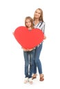 Cute little girl and her mother with big red heart on white background Royalty Free Stock Photo