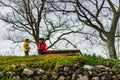 Cute little girl with her mother in vineyards, spring sunny day Royalty Free Stock Photo