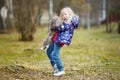 Cute little girl with her pet cat on chilly autumn day Royalty Free Stock Photo