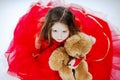 Cute little girl with her teddy-bear toy friend Royalty Free Stock Photo