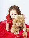 Cute little girl with her teddy-bear toy friend Royalty Free Stock Photo