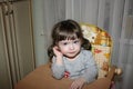 Cute little girl in a high chair