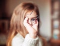 Cute little girl holding big christmas star and looking through it. Royalty Free Stock Photo