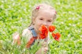 Cute little girl holding a bouquet Royalty Free Stock Photo