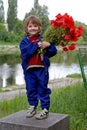 Cute little girl is holding a bouquet poppies Royalty Free Stock Photo