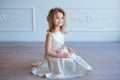 Cute little girl holding a bunny. Spring and easter portrait of beautiful child with rabbit.