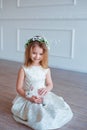 Cute little girl holding a bunny. Spring and easter portrait of beautiful child with rabbit.