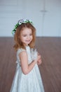 Cute little girl holding a bunny. Spring and easter portrait of beautiful child with rabbit.