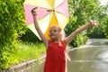 Cute little girl holding a colorful umbrella in her hands and enjoying the sun after the rain Royalty Free Stock Photo