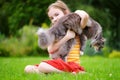 Cute little girl holding giant pet cat Royalty Free Stock Photo