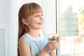 Cute little girl holding glass of fresh water Royalty Free Stock Photo