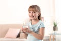 Cute little girl holding glass of fresh water Royalty Free Stock Photo