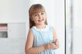 Cute little girl holding glass of fresh water Royalty Free Stock Photo