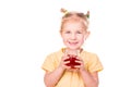 Cute little girl holding glass with juice smiling Royalty Free Stock Photo