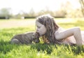 Cute little girl holding her funny boxer dog Royalty Free Stock Photo