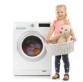 Cute little girl holding laundry basket with teddy Royalty Free Stock Photo