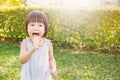 Cute little girl holding the lollipop in the par Royalty Free Stock Photo