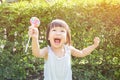 Cute little girl holding the lollipop in the par Royalty Free Stock Photo