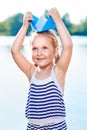 Cute little girl holding origami boat outdoors Royalty Free Stock Photo