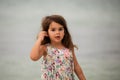 Cute little girl holding seashell Royalty Free Stock Photo