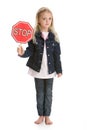 Cute little girl holding a stop sign on white Royalty Free Stock Photo