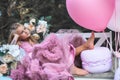 Cute little girl holds French Macaron. Confectionery concept Royalty Free Stock Photo