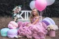 Cute little girl holds French Macaron. Confectionery concept Royalty Free Stock Photo