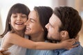 Cute little girl hug mom and dad showing love Royalty Free Stock Photo