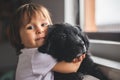 Cute little girl hug and play with her puppy Royalty Free Stock Photo