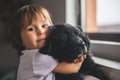 Cute little girl hug and play with her puppy Royalty Free Stock Photo