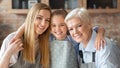 Cute little girl hugging her mom and granny Royalty Free Stock Photo