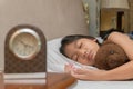 Cute little girl hugging teddy bear sleeping lay in  bed Royalty Free Stock Photo