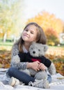 Cute little girl hugging teddy bear toy Royalty Free Stock Photo