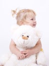 Cute little girl hugging teddybear