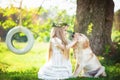 Cute little girl hugs a big dog in summer park Royalty Free Stock Photo