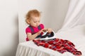 Cute little girl with an iron. Royalty Free Stock Photo