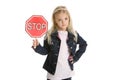 Cute little girl isolated, holding a stop sign