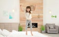 Cute little girl jumping on bed Royalty Free Stock Photo