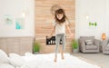 Cute little girl jumping on bed Royalty Free Stock Photo