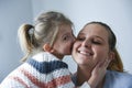 Cute little girl kissing her mother Royalty Free Stock Photo