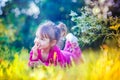 Cute little girl laying in a field Royalty Free Stock Photo