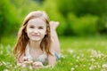 Cute little girl laying in the grass Royalty Free Stock Photo