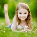 Cute little girl laying in the grass Royalty Free Stock Photo