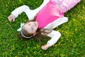 Cute little girl laying in the grass Royalty Free Stock Photo