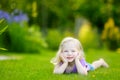 Cute little girl laying in the grass Royalty Free Stock Photo