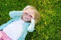 Cute little girl laying in the grass Royalty Free Stock Photo