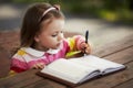 Cute little girl learning to write Royalty Free Stock Photo